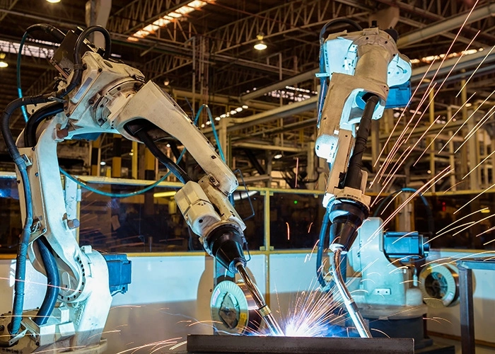 Multiple robotic welding systems in large factory environment