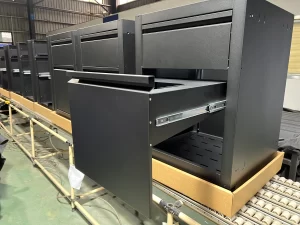 Finished black metal drawer cabinet with smooth slide-out drawer assembly